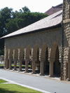 An arcade at Stanford University, standing in for universities in general